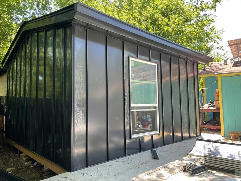 Black standing seam metal wall panels for Roof Inspection in Harrisonville